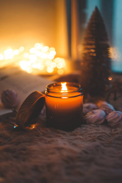 istock Burning candle in a festive cozy atmosphere 1833035280