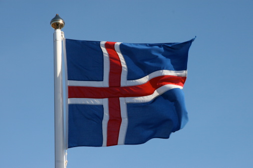 A flag of Iceland is blowing in the wind. Picture was taken at Thingvellir Nationalpark