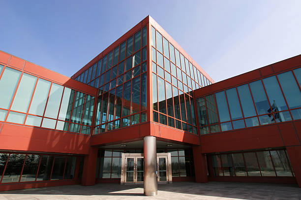 istock Entrance to a big red building with many windows 183304122