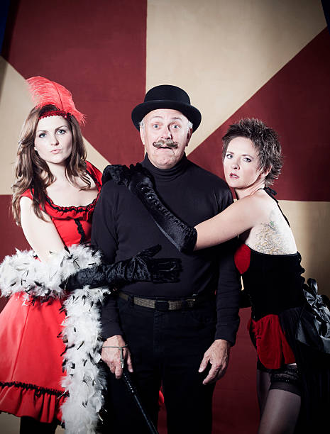 istock Carnival Trio Man Startled by Beautiful Women 183304180