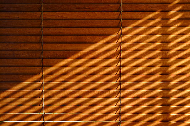 Venetian blind shadows Sunlight through one venetian casts shadows on another. window blinds photos stock pictures, royalty-free photos & images