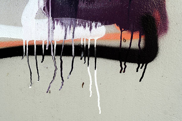 istock Fragment of graffiti with paint tears on a wall 183304544
