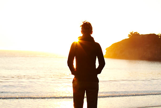 istock Young woman looking at sunset 183304703