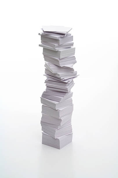 istock Pile of messily stacked white papers on white background 183305019