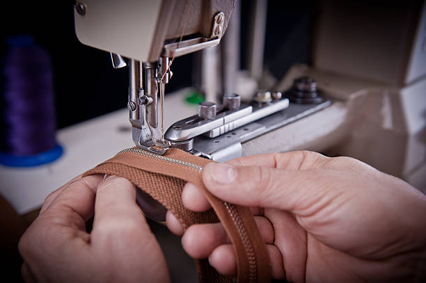 Sewing man stock photo