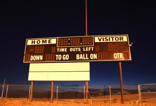 football scoreboard at night