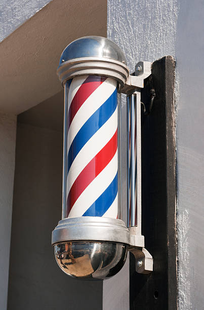istock Barber Shop Pole Sign in Classic Stripe Design Outside Storefront 183305144