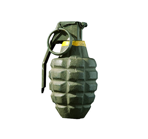 Green hand grenade isolated on white background A hand grenade isolated on white. hand grenade stock pictures, royalty-free photos & images