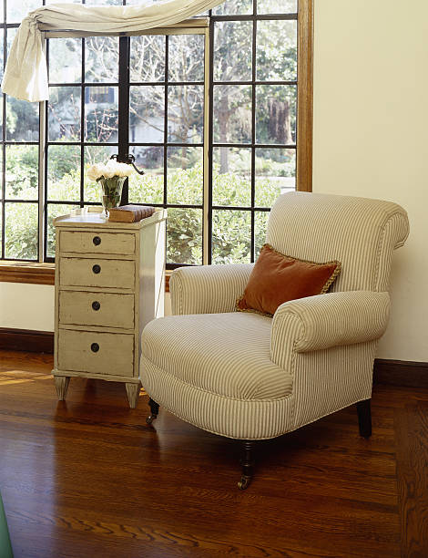 istock Comfortable cream armchair in front of window 183305881