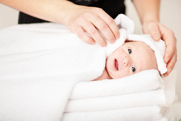 istock Newborn being towel dried after having his bath 183306131