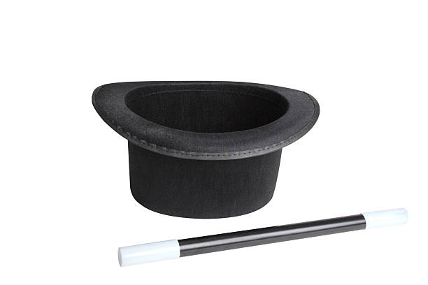 Black top hat and wand isolated on white with clipping path.For more of my MAGIC pictures click