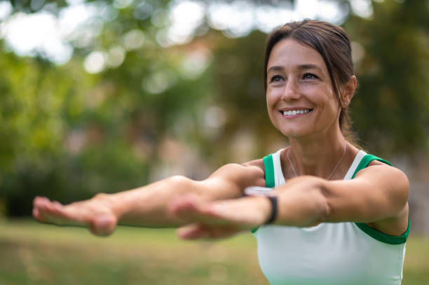istock Cute dark-haired woman doing squats and smiling 1833066446