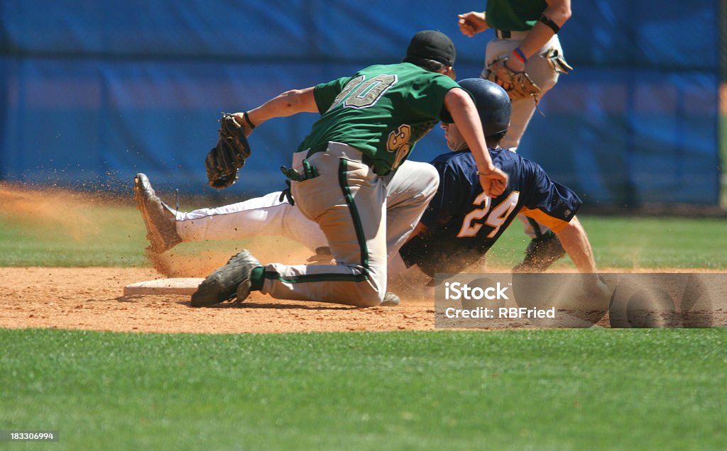 Two baseball players playing a game of baseball a play at second in baseball Baseball - Sport Stock Photo