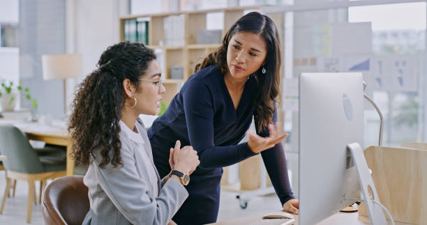 istock Computer, discussion and manager with woman for training in the office for law project in collaboration. Conversation, technology and female leader talking to employee on desktop in modern workplace. 1833072213