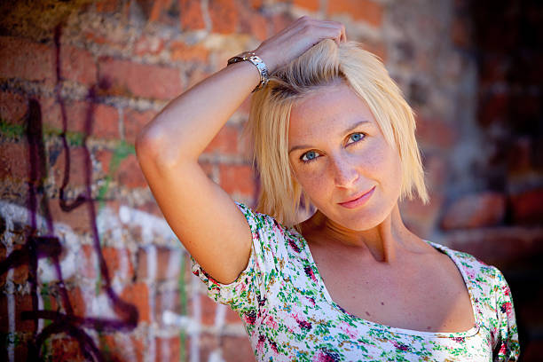 istock Blonde lady on street wall 183311449
