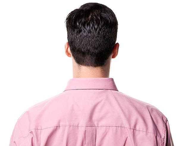 Rear View of Man Rear-view of a man wearing a pink collared shirt. head stock pictures, royalty-free photos & images