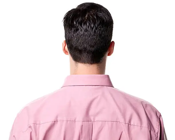 Rear-view of a man wearing a pink collared shirt.