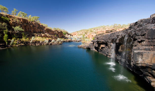 Manning Gorge Picturesque Manning Gorge along the Gibb River Road in the remote Kimberley region of Western Australia.  The area under the falls is arguably one of the best swimming holes in the Kimberley. kimberley plain stock pictures, royalty-free photos & images