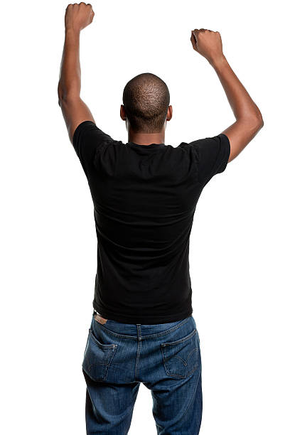 Young Man With Arms Up, Shaking Fists, Rear View Portrait of a young male on a white background. http://s3.amazonaws.com/drbimages/m/courow.jpg ass boy stock pictures, royalty-free photos & images