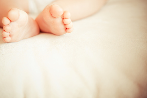 baby feet soft background image ideal for birth announcements.