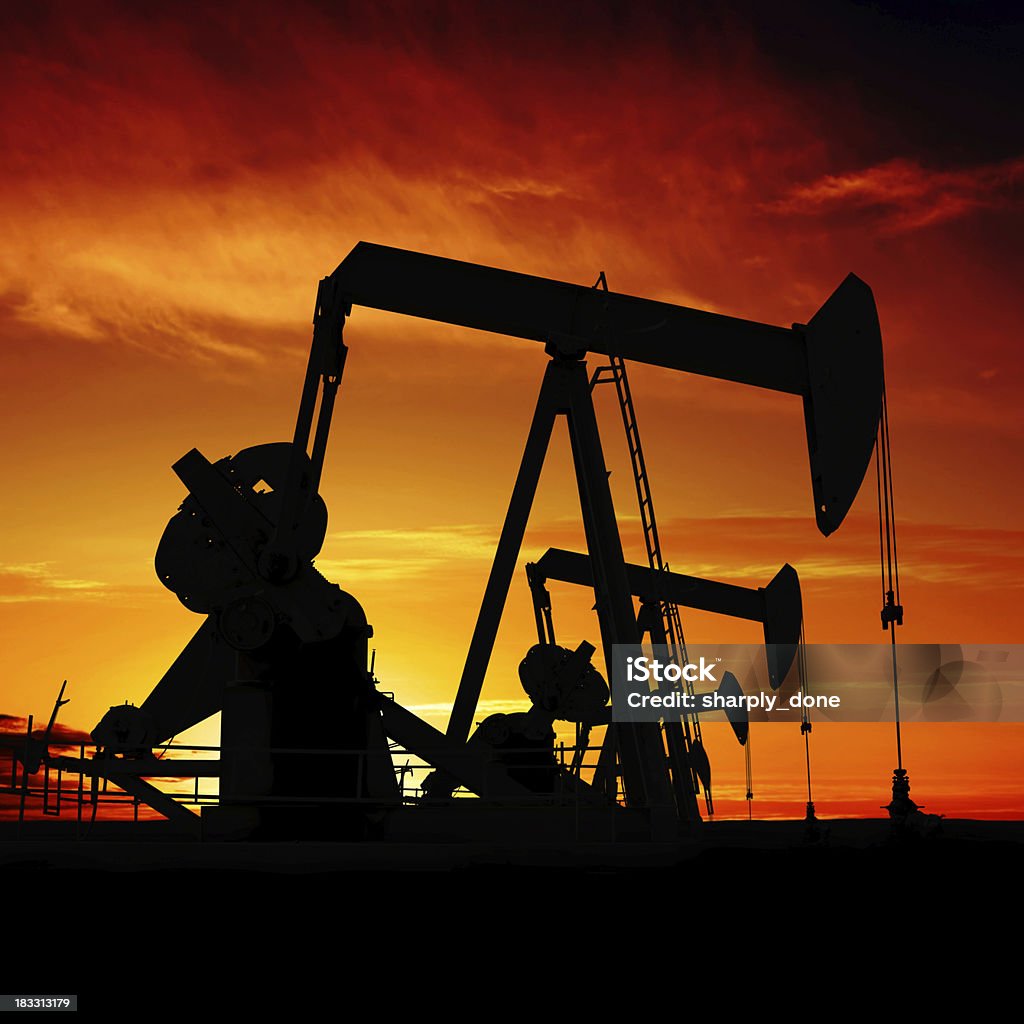 XXXL pumpjack silhouettes "oil pumpjacks in silhouette at sunset, square frame (XXXL)" Texas Stock Photo