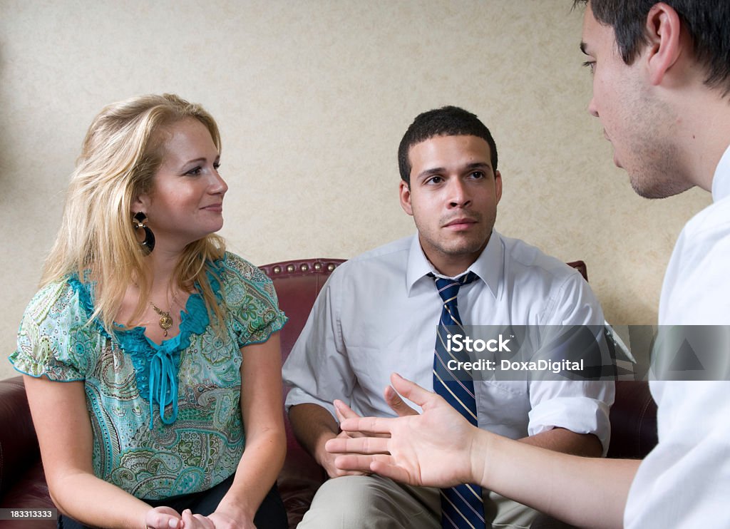 A couple at marriage counselling Young couple receiving marriage counseling. Latin American and Hispanic Ethnicity Stock Photo