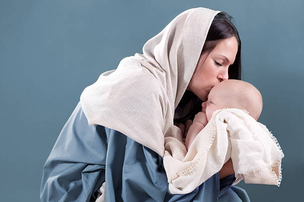 Nativity Scene with Mary and Baby Jesus Nativity scene with real mother and baby. west bank stock pictures, royalty-free photos & images