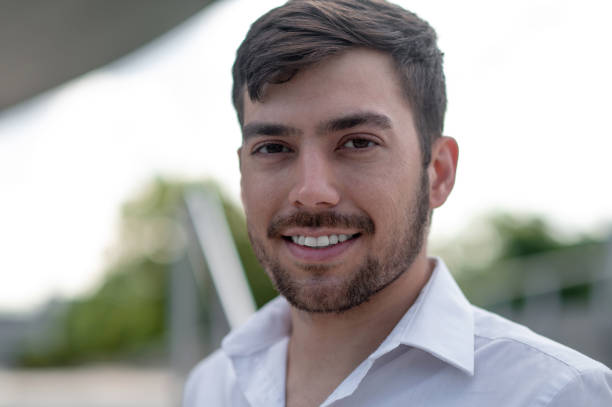 istock Bearded young man looking contented and smiling 1833139532