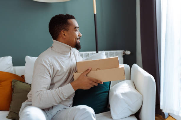 istock Young African American man has just received his online order 1833140623