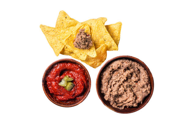 istock Nachos chips with tomato sauce and jalapeno, mexican appetizer. Isolated, white background. 1833142761