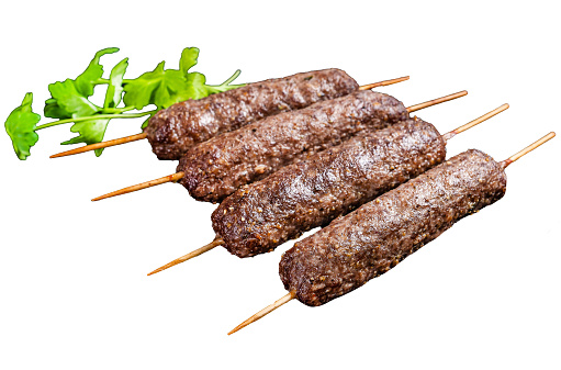 Grilled shish kebab, arabic kofta kofte kebab from mince lamb and beef meat on Skewer.  Isolated, white background