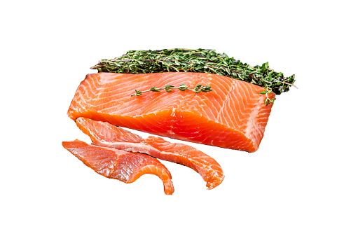 Slices of lightly salted salmon with thyme in a steel tray Isolated, white background