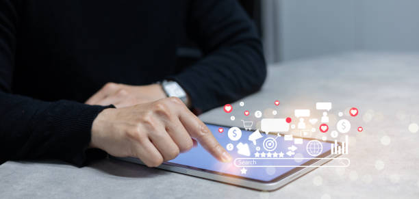 istock close up businessman hand pressing on digital tablet screen to use function about pay per click and affiliated of social media marketing for business and technology concept 1833146495