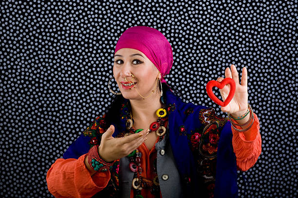 istock Gypsy fortune teller holding heart shapped object 183314836