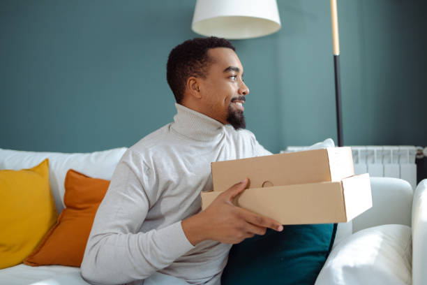 istock Young African American man has just received his online order 1833149458