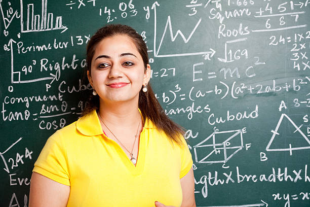 istock Attractive Young Cheerful Indian Mathematics Teacher in Classroom with Greenboard 183315021