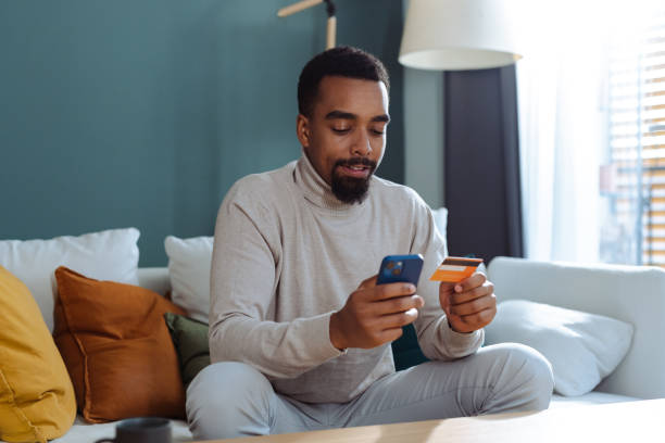 istock Young African American man using online payment services 1833151218