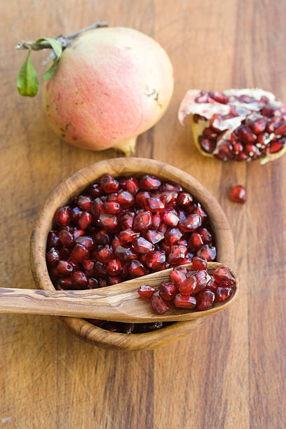 istock Pomegranate Seeds in an Wood Blowl 183315210