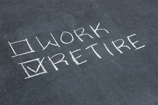 Work or retire checkboxes on a chalkboard.