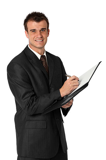 istock Businessman writing in a file 183315503