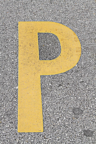 istock Yellow letter P on asphalt pavement 183315653