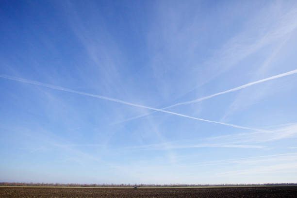 istock A snowy field in winter, and large Cumulus clouds above it. 1833157816