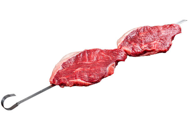 istock Ready for cooking raw picanha barbecue skewer.  Isolated, white background. 1833164139