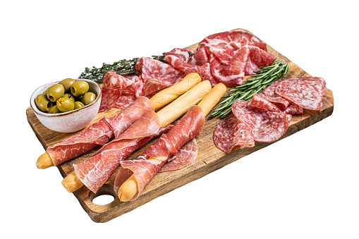 Antipasto platter cold meat plate with grissini bread sticks, Prosciutto crudo, Salami and Coppa Sausage.  Isolated, white background