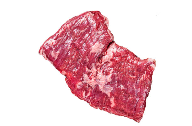 Raw skirt beef steak on meat cleaver.  Isolated, white background.