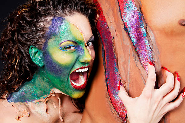 istock Sexy alien ripping a man's skin 183316906
