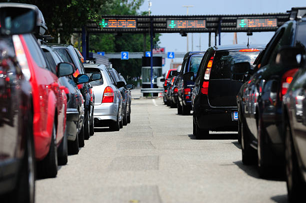 istock Car queues, waiting to pass road toll 183317081