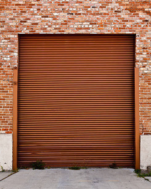 istock Corrugated Steel Door in Brick Building 183317142