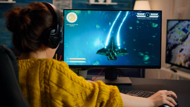 istock Pro gamer playing in the first person shooter on personal computer 1833172040