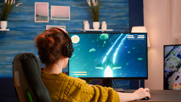 istock Pro gamer putting on headset testing new space shooter video game 1833172573